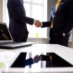 salesperson-men-coworkers-rep-hire-selling-agreement-handshake-successful